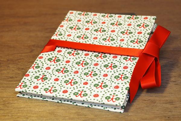 Leporello with anchor and flowers red, green, white and red bow